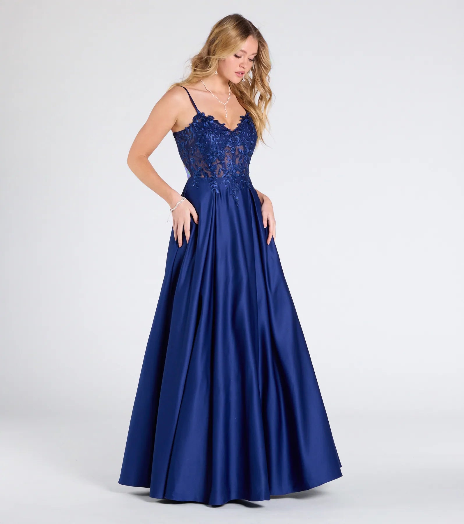 The Myra Lace-Up Floral Embroidered A-Line Ball Gown in luxe navy blue fabric, a stunning prom dress with statement details designed to make a bold impression at Prom 2025.