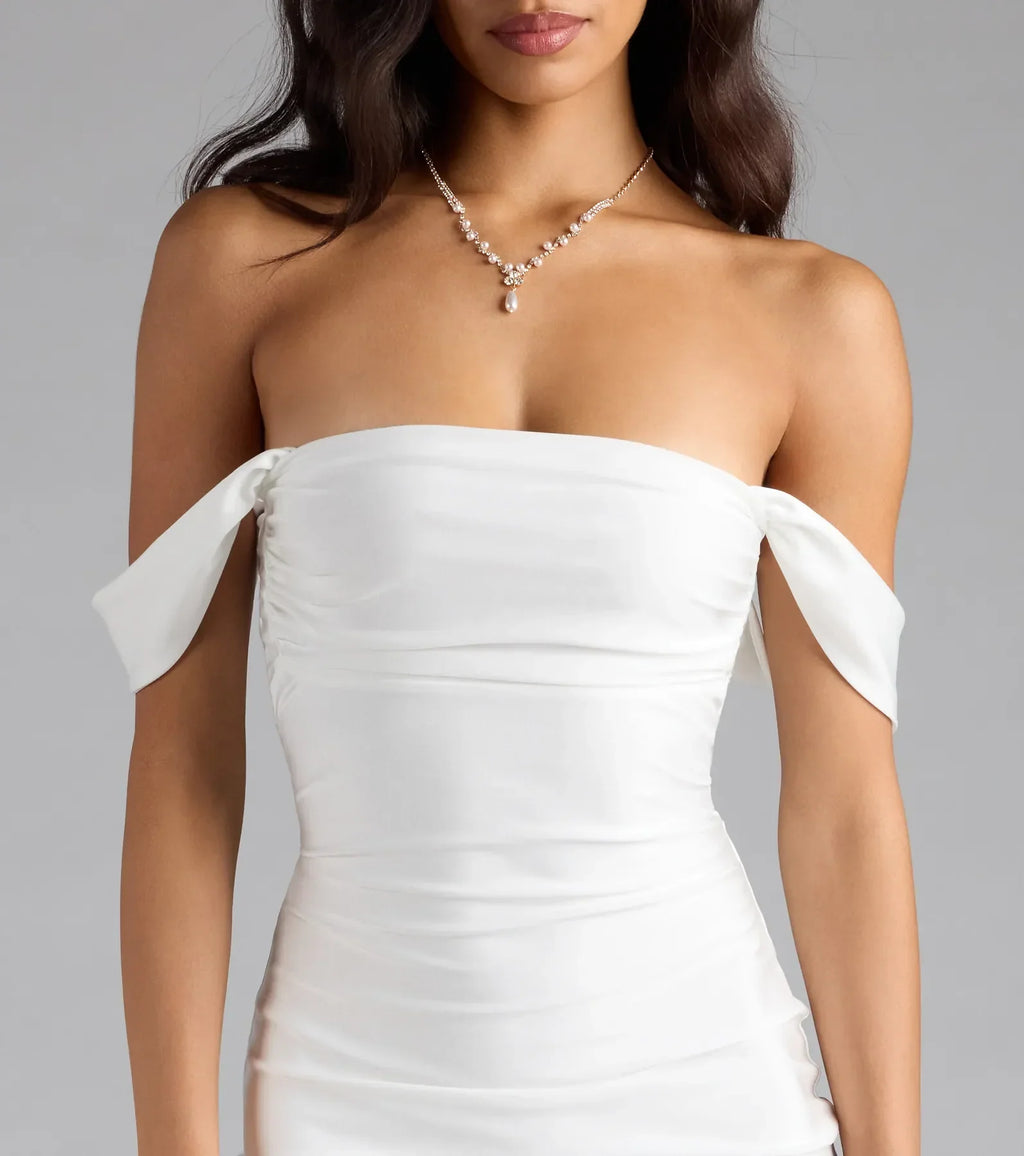 Step into the new season looking effortlessly chic in the Exceptional Off-The-Shoulder Flared Midi Dress in white, a must-have Windsor dress for your cool-weather wardrobe.