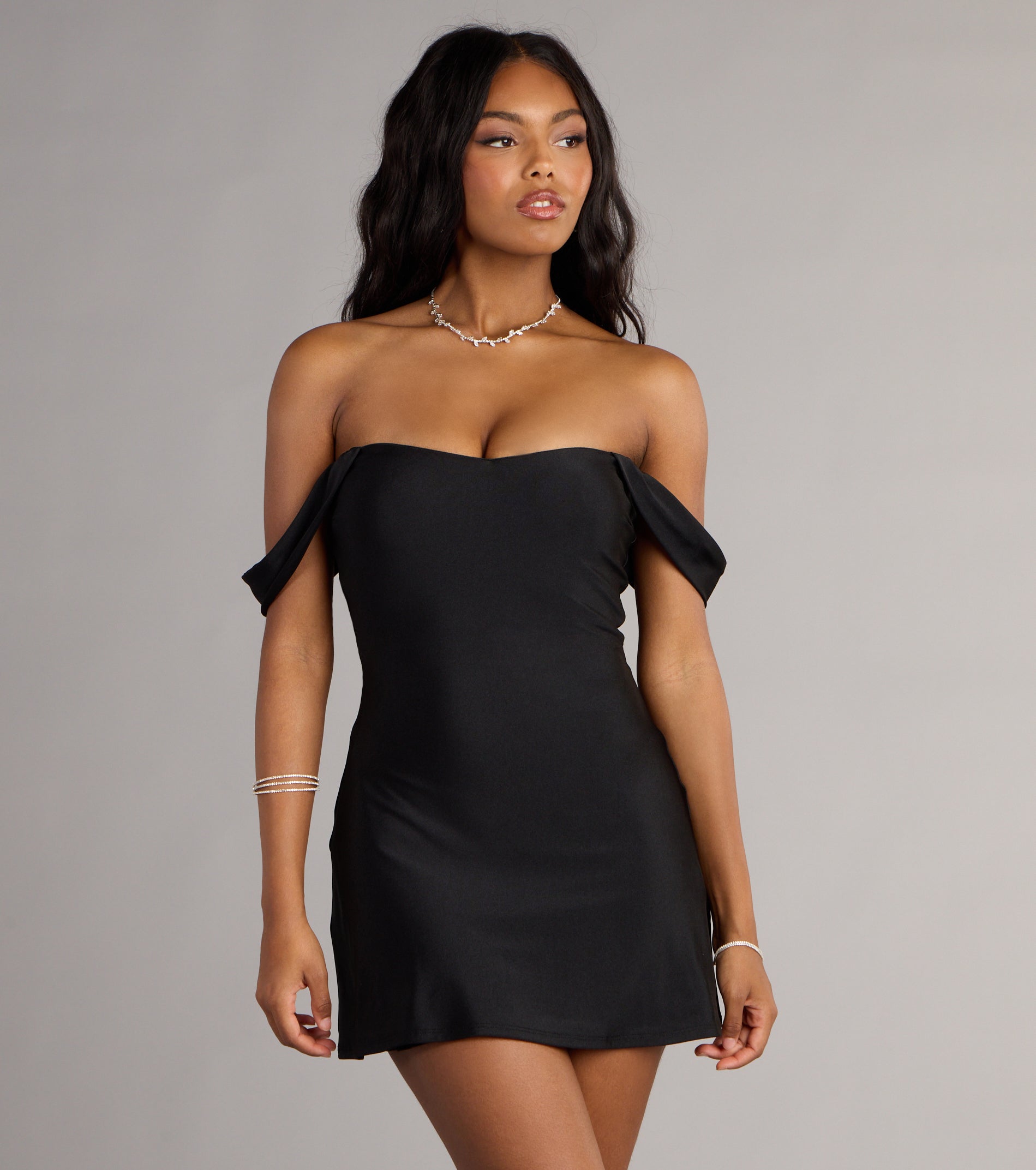 The Effortless Charm Off-The-Shoulder Mini Dress is your new go-to Windsor dress—effortless, versatile, and made to update your fall style in seconds.