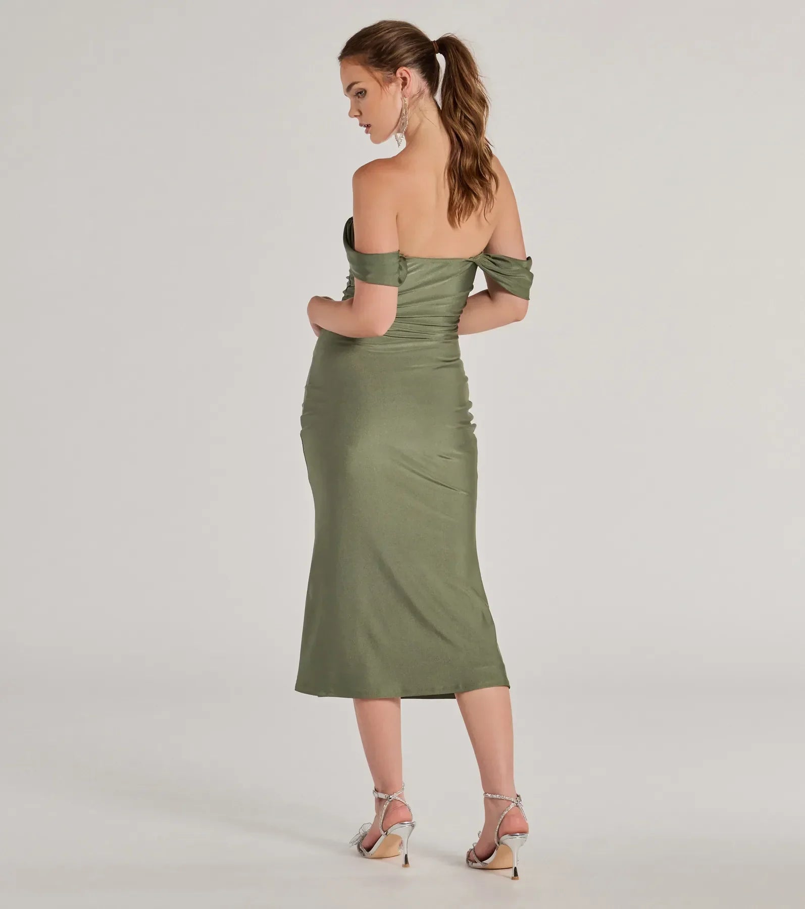 Feel instantly put-together in the Exceptional Off-The-Shoulder Flared Midi Dress in sage green, a fall wedding guest dress designed for confident style and all-out celebration.