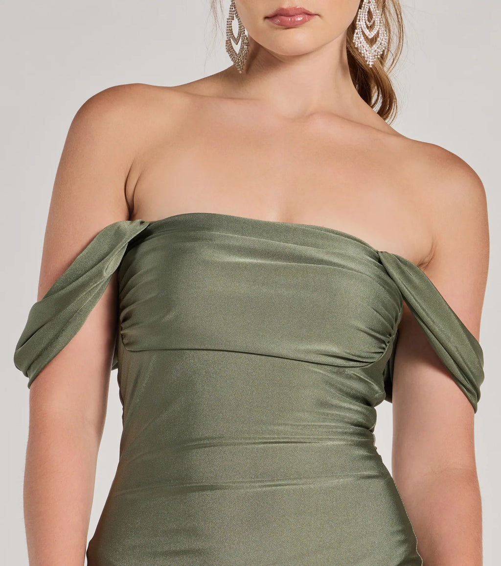 Make a bold statement in the Exceptional Off-The-Shoulder Flared Midi Dress in sage green, the perfect green dress for weddings, cocktail hours, nights out, and/or seasonal celebrations.