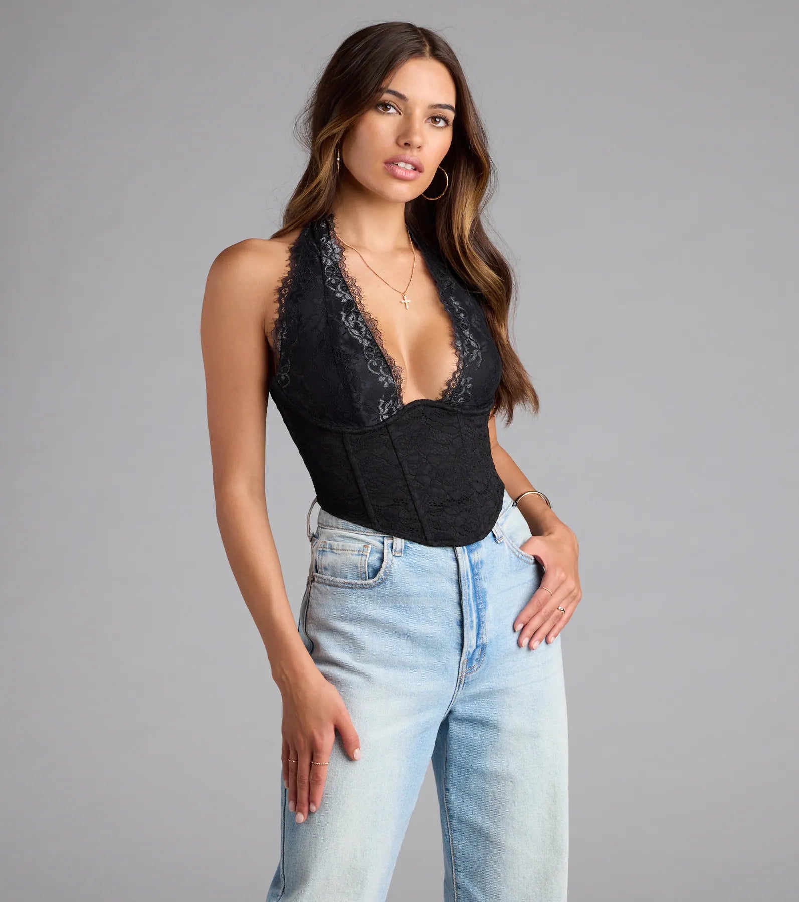With its midriff cut and trend-forward fit, the Gorgeous Night Lace Trim Corset Halter Top is a black crop top made to pair with skirts, denim, or whatever vibe you're feeling this season.