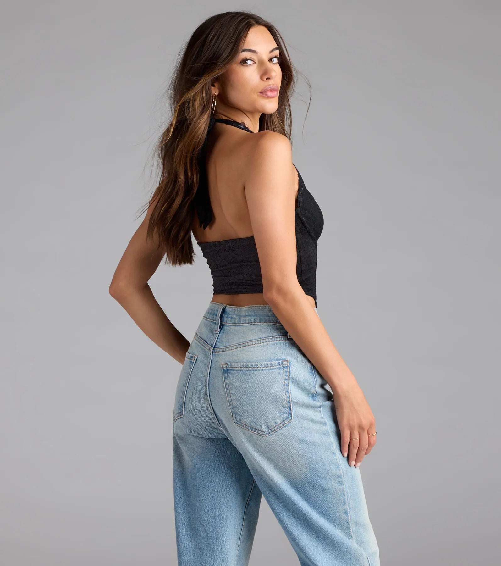For college campus looks, game day outfits, or a bold going-out vibe, the Gorgeous Night Lace Trim Corset Halter Top is an on-trend black crop top that easily styles with your favorite denim.