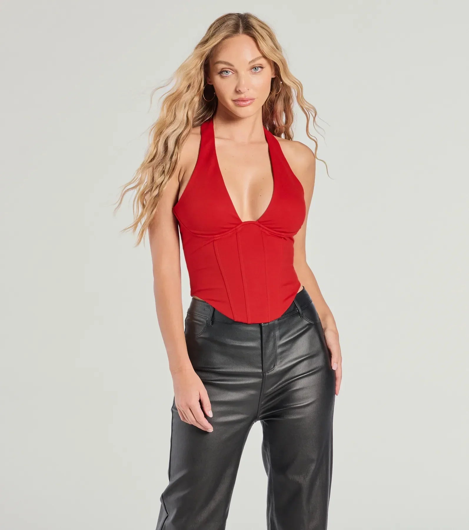 The Sleek And Stunning Corset Halter Top in red with a modern design and trendy look is part of the latest women's tops collection to elevate your 2025 wardrobe.