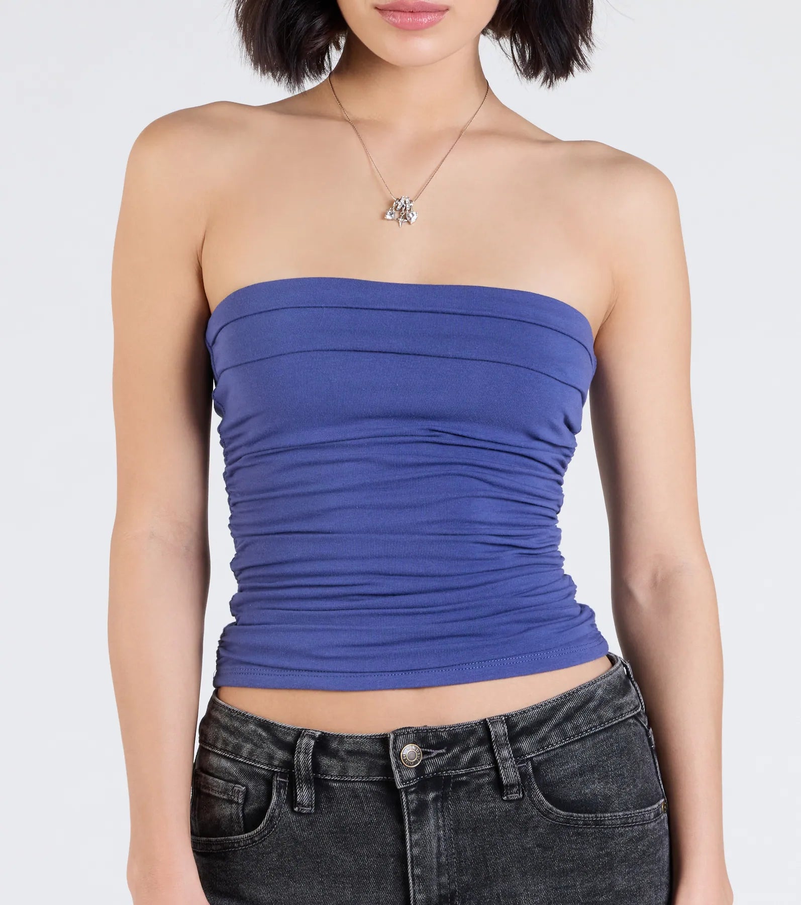 Trendy women’s tops, like the Cutest Vibe Ruched Knit Tube Top, bring effortless style for fall layering, lounging, or going out.