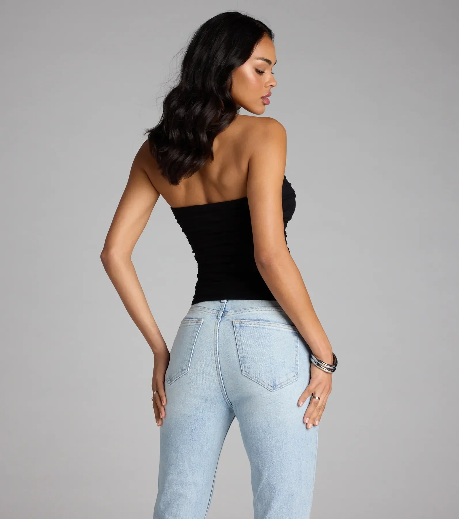 Trendy women’s tops, like the Cutest Vibe Ruched Knit Tube Top, bring effortless style for fall layering, lounging, or going out.