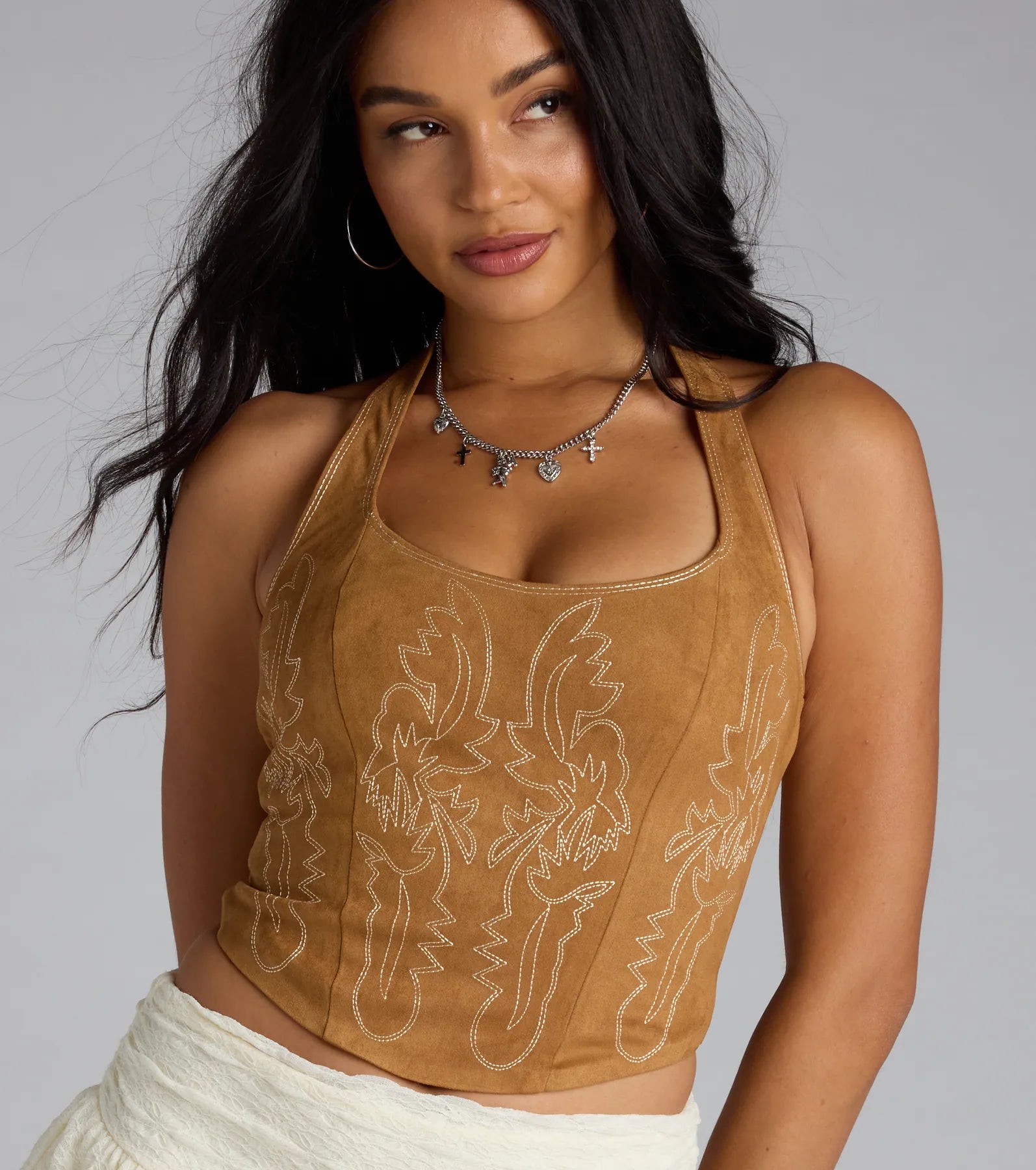 For college campus looks, game day outfits, or a bold going-out vibe, the Cute Flame Stitch Lace-Up Crop Top is an on-trend camel brown crop top that easily styles with your favorite denim.