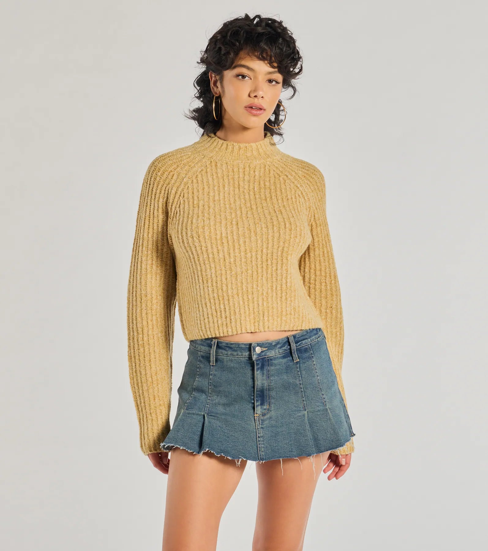 The Stylishly Casual Mock Neck Knit Sweater in mustard yellow with a modern design and trendy look is part of the latest women's tops collection to elevate your 2025 wardrobe.