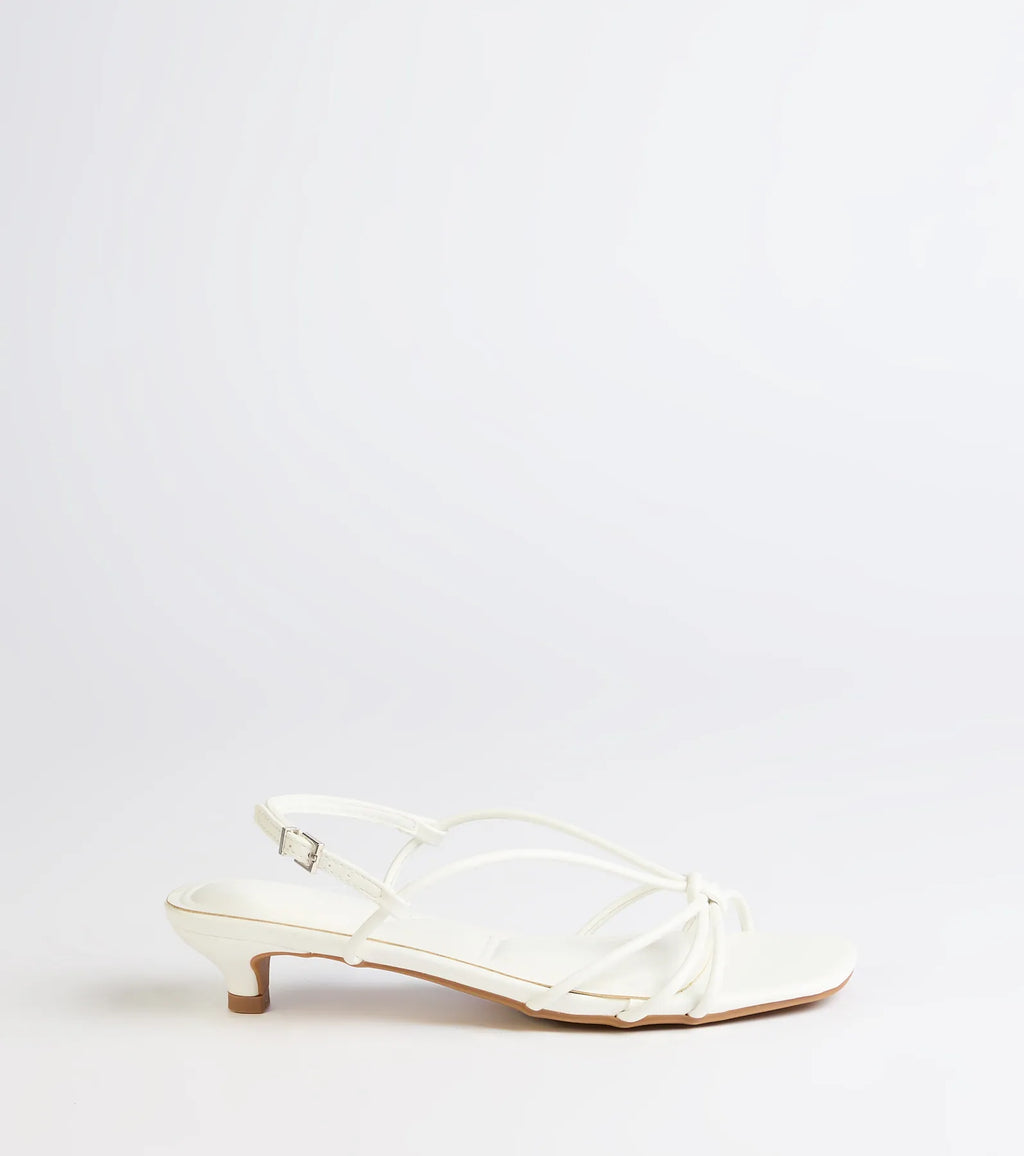 Turn heads in the Tied Together Strappy Kitten Heels, white heels showcasing a fresh trend or stylish detail made to elevate your full Windsor fit.