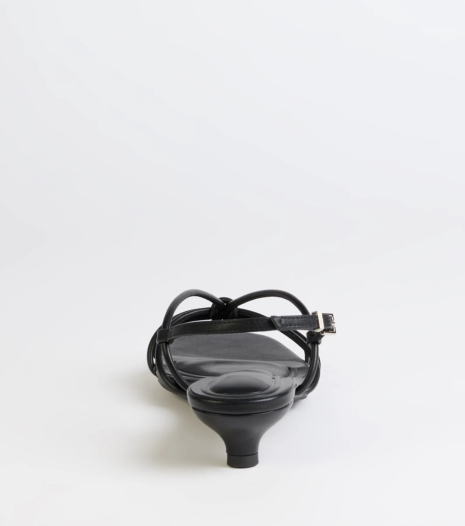 Turn heads in the Tied Together Strappy Kitten Heels, black heels showcasing a fresh trend or stylish detail made to elevate your full Windsor fit.