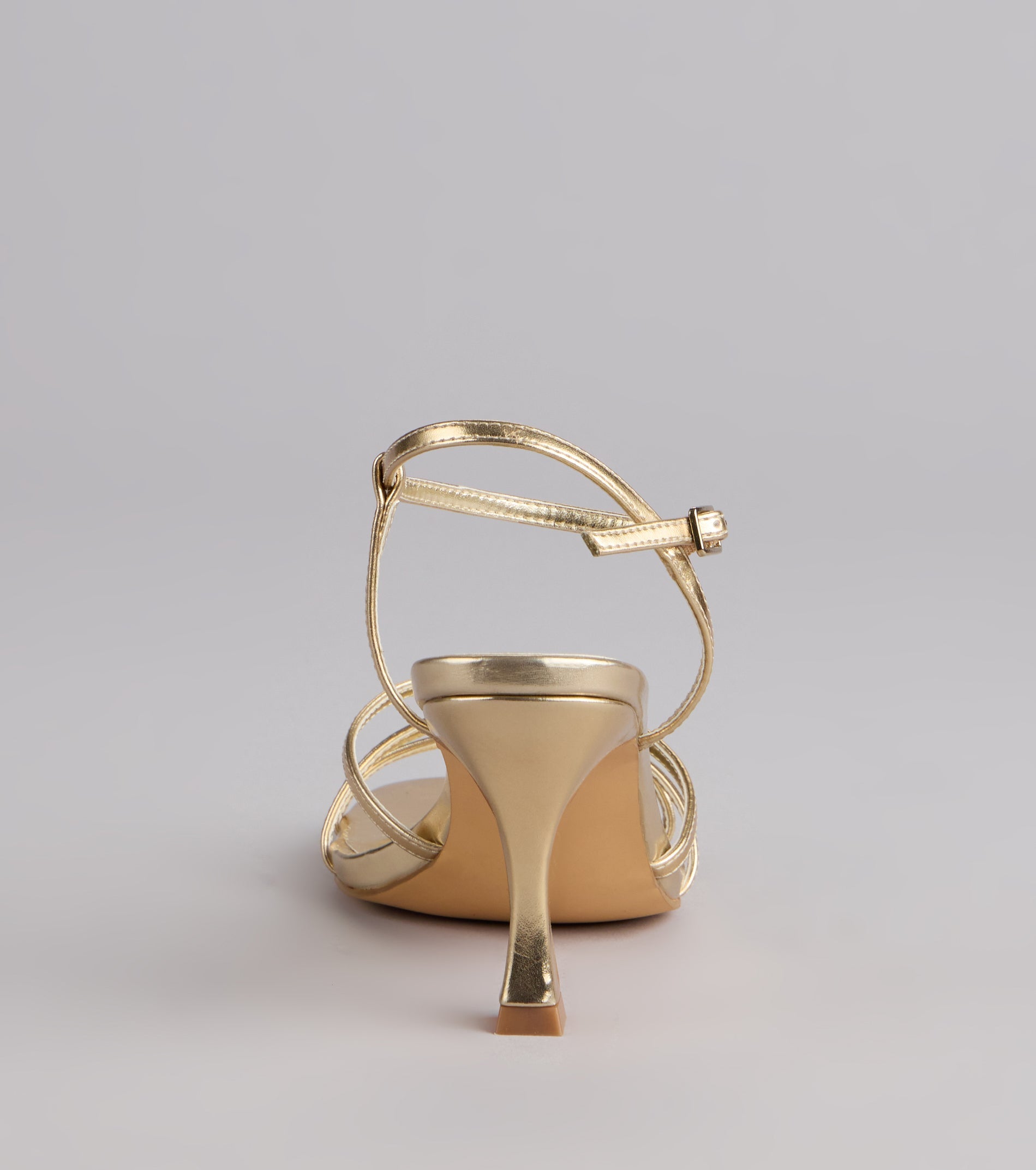 Style made simple with the Shine Hour Metallic Strappy Stiletto Heels, trendy women’s shoes that take your outfit from basic to bold in one step.