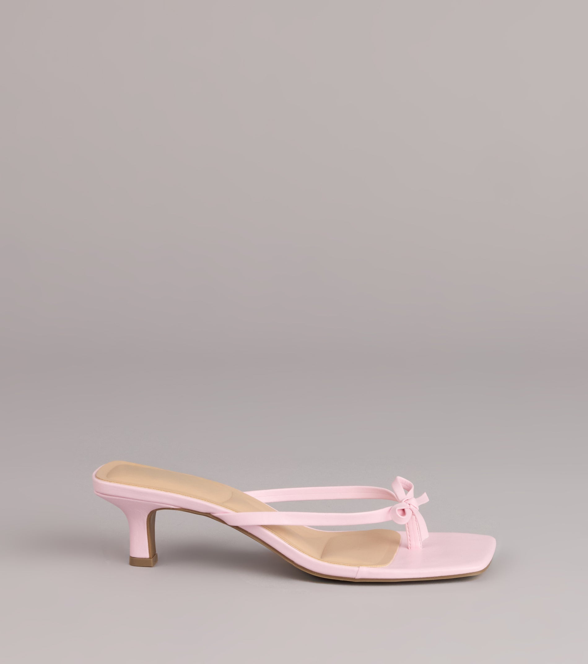 Style made simple with the Play Nice Bow Thong Heels, trendy women’s shoes that take your outfit from basic to bold in one step.