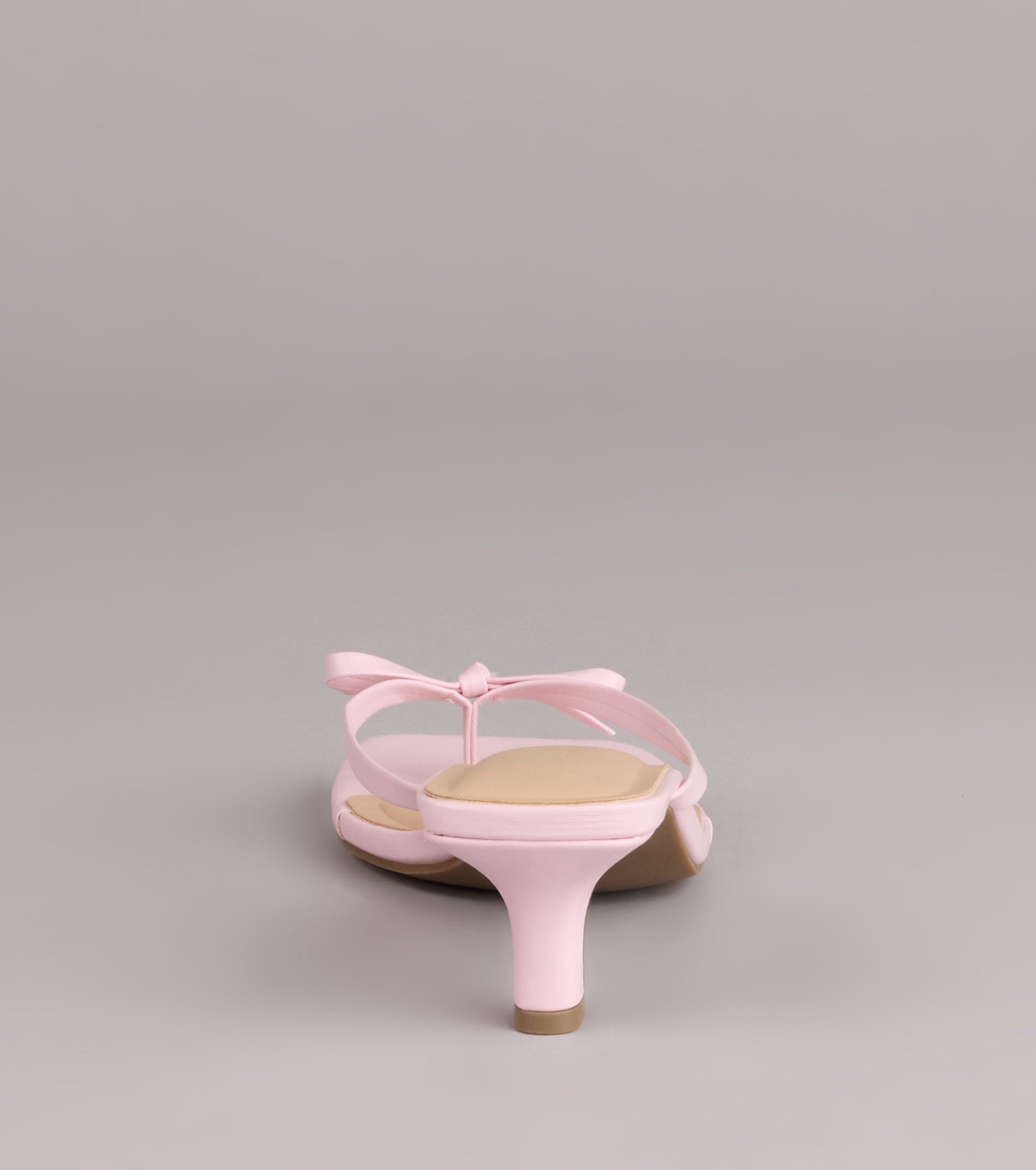 Style made simple with the Play Nice Bow Thong Heels, trendy women’s shoes that take your outfit from basic to bold in one step.