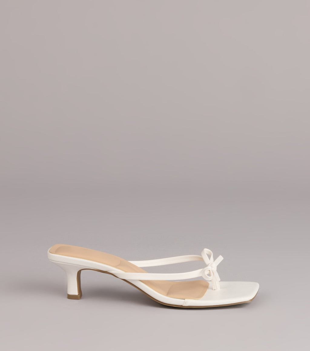 Style made simple with the Play Nice Bow Thong Heels, trendy women’s shoes that take your outfit from basic to bold in one step.