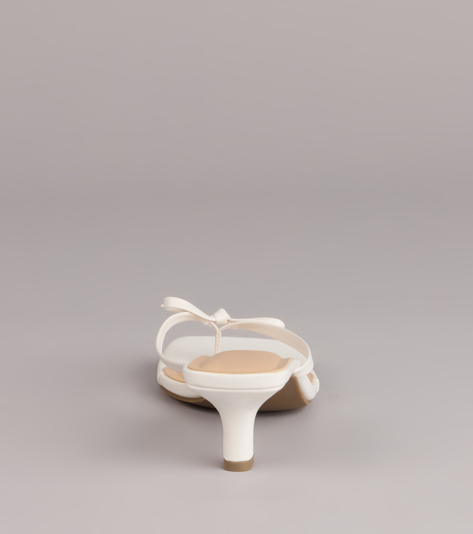 Style made simple with the Play Nice Bow Thong Heels, trendy women’s shoes that take your outfit from basic to bold in one step.