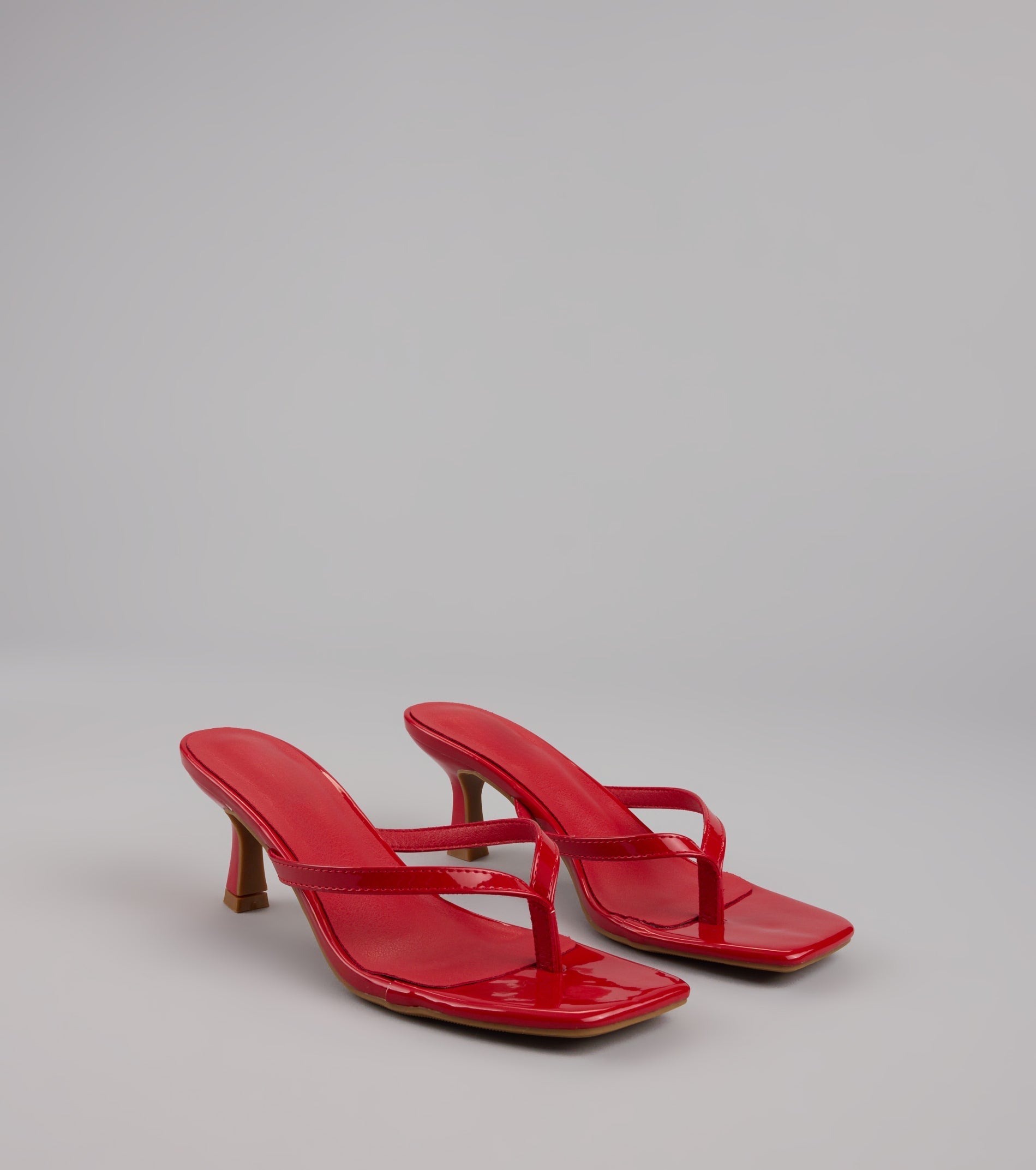 Style made simple with the Sleek Obsessions Patent Thong Kitten Heels, trendy women’s shoes that take your outfit from basic to bold in one step.