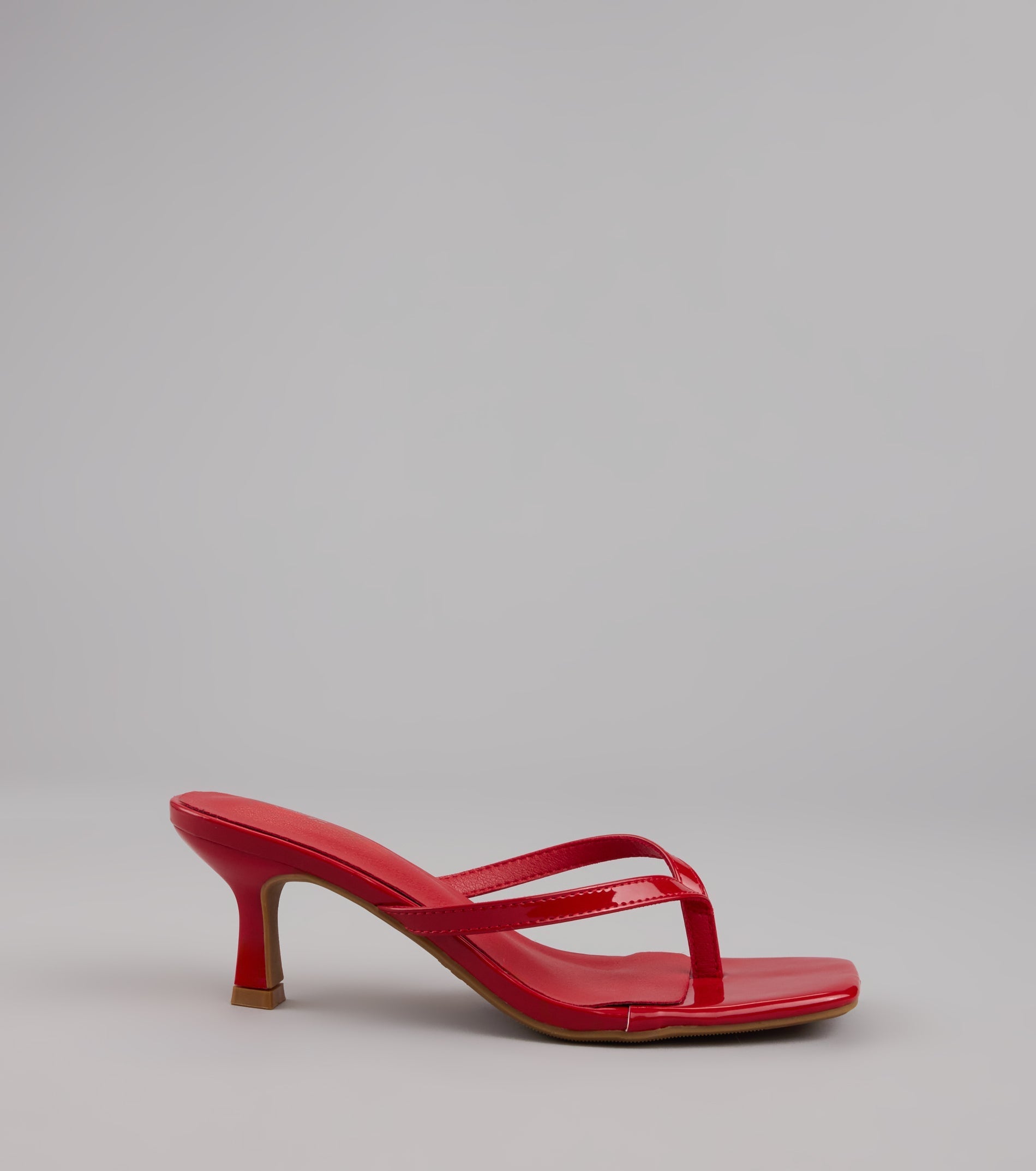 Style made simple with the Sleek Obsessions Patent Thong Kitten Heels, trendy women’s shoes that take your outfit from basic to bold in one step.