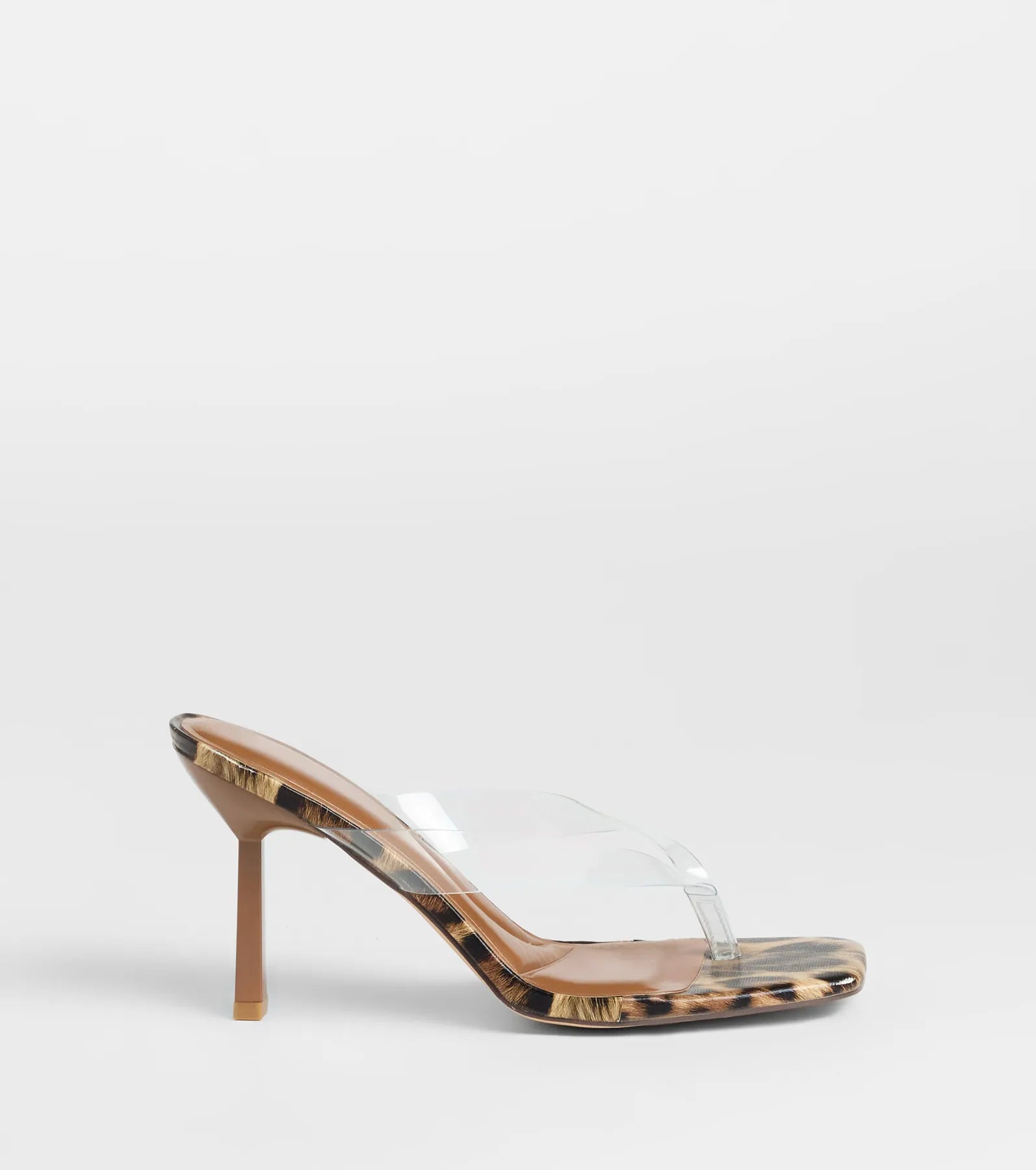 Turn heads in the Lady In Leopard Thong Stiletto Mules, leopard print heels showcasing a fresh trend or stylish detail made to elevate your full Windsor fit.