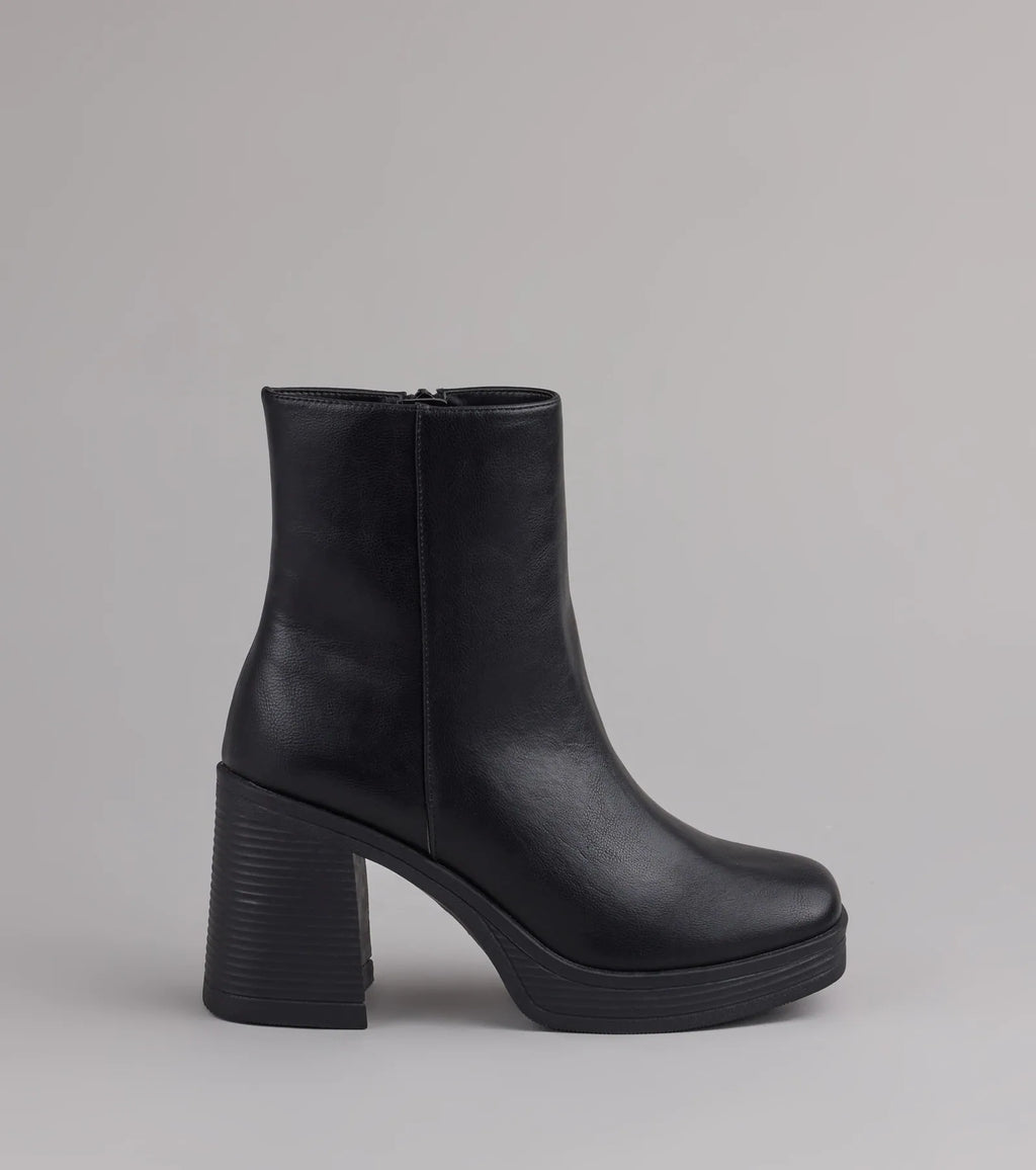 Style made simple with the Tough Love Platform Block Heel Booties in black, trendy women’s shoes that take your outfit from basic to bold in one step.