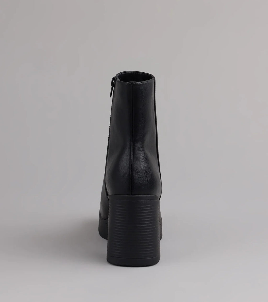 Style made simple with the Tough Love Platform Block Heel Booties in black, trendy women’s shoes that take your outfit from basic to bold in one step.