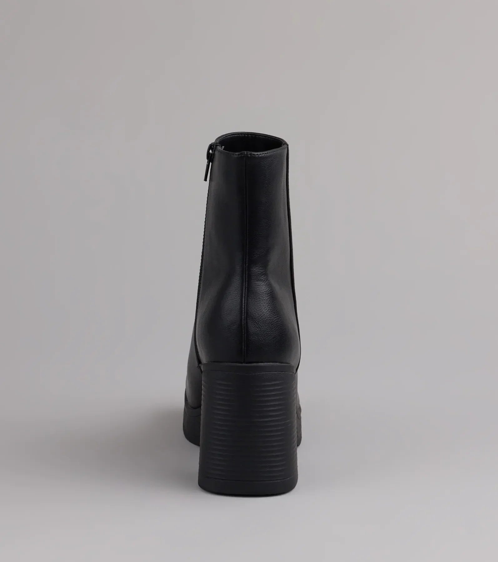 Style made simple with the Tough Love Platform Block Heel Booties in black, trendy women’s shoes that take your outfit from basic to bold in one step.